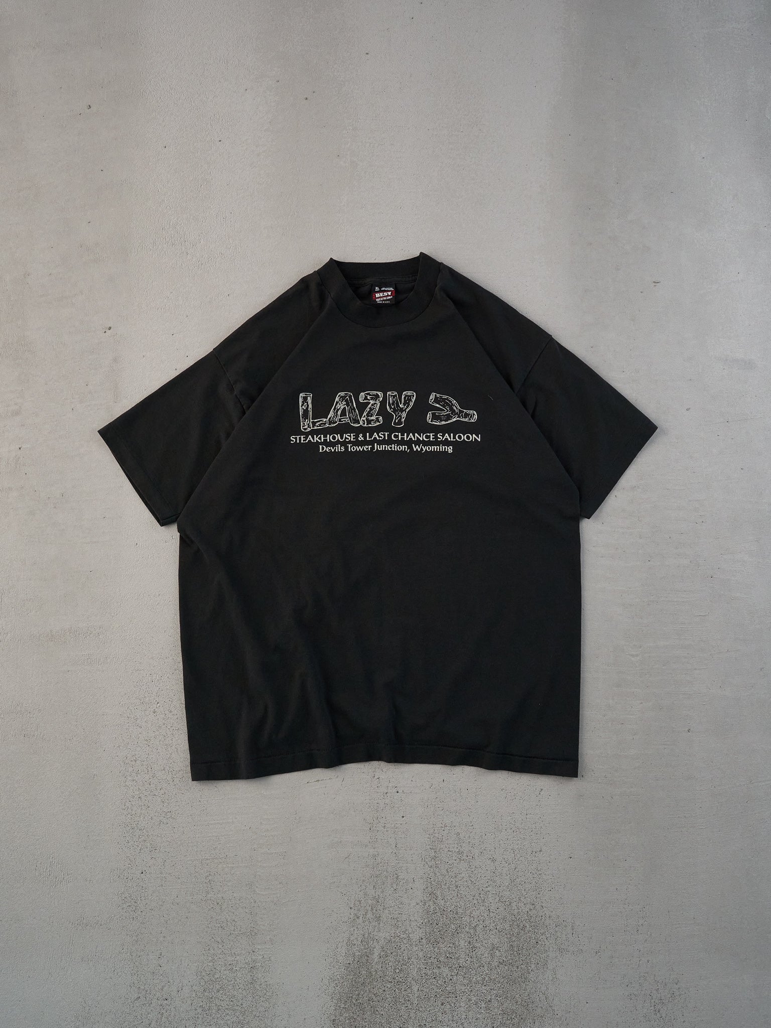 Vintage 90s Black Single Stitched "Famous For Nothing But We Have Towering Good Food" Tee (M/L) - Image 2