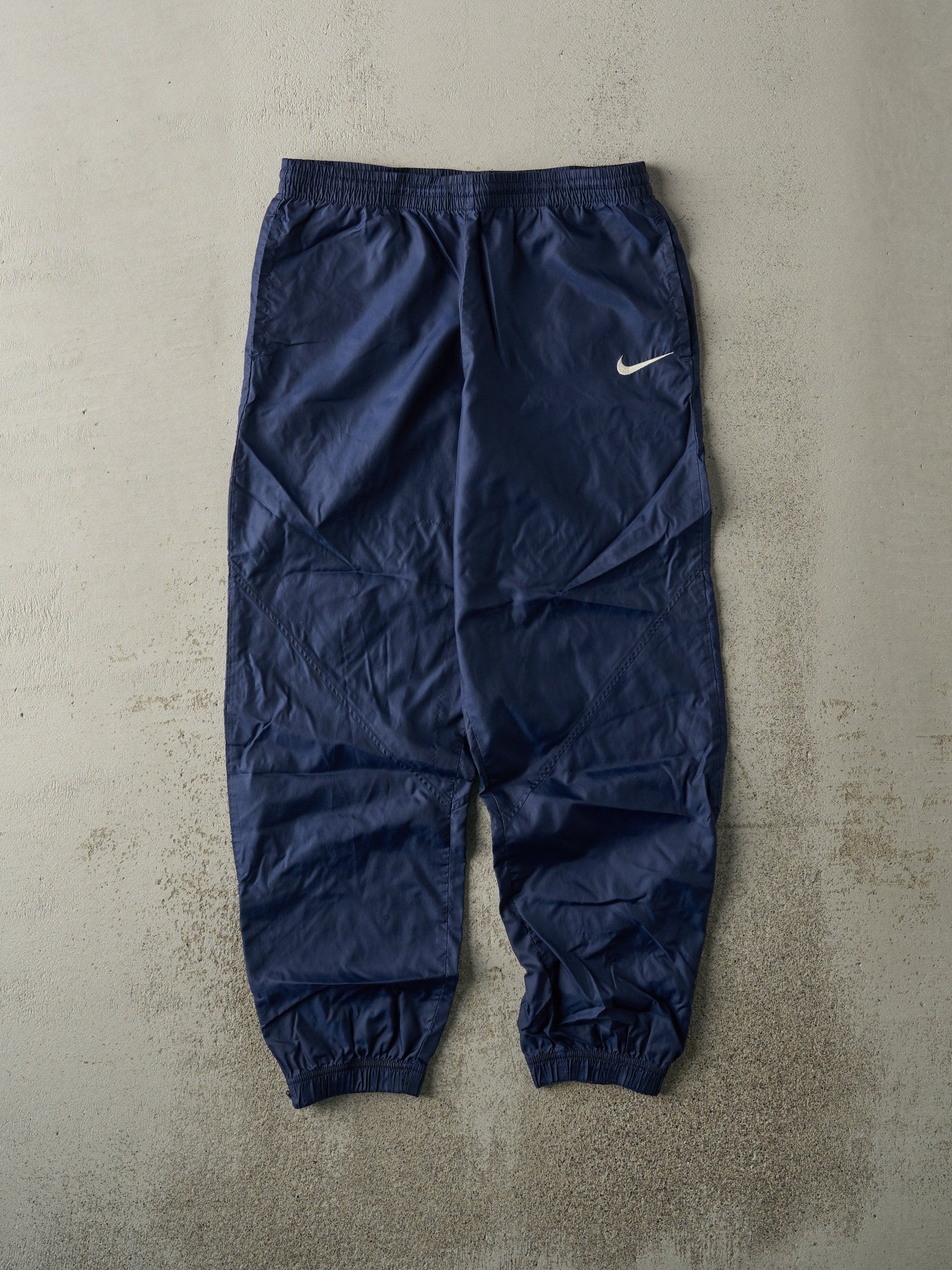 Vintage 90s Navy Blue Embroidered Nike Windbreaker Pants (30x27.5)