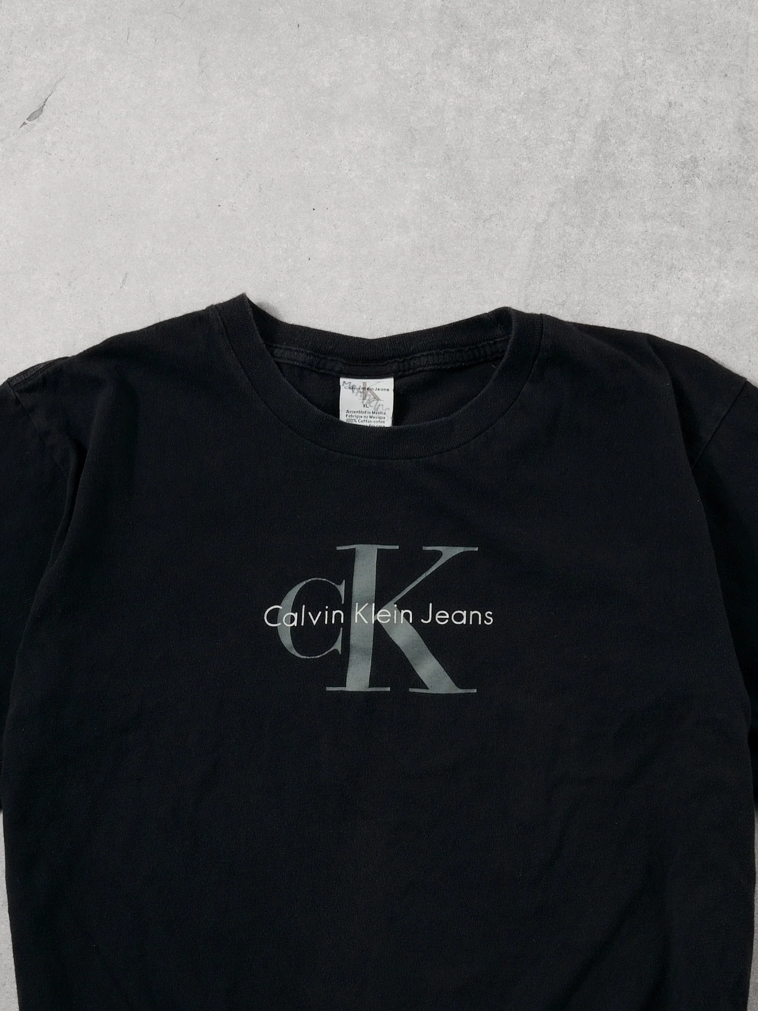 Vintage 90s Washed Black Clavin Klein Graphic Tee (M) - Image 2